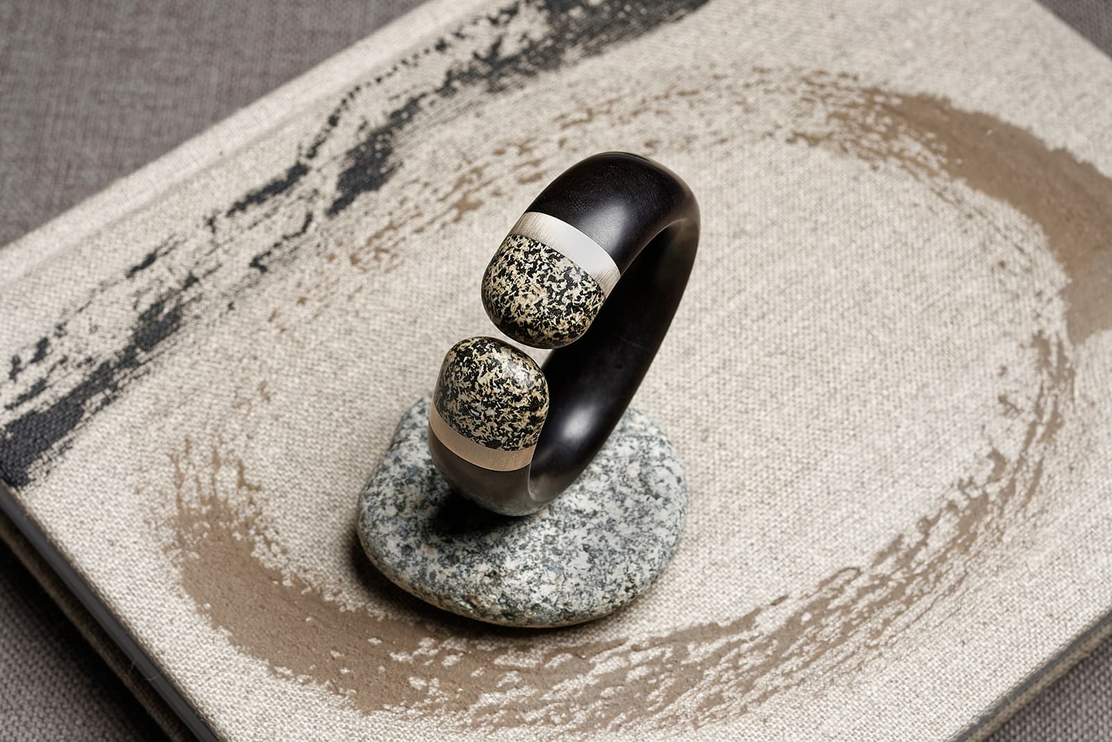  Hemmerle Harmony bangle with pebbles, orange tree wood, aluminium and white gold, 2020, private collection, courtesy Hemmerle