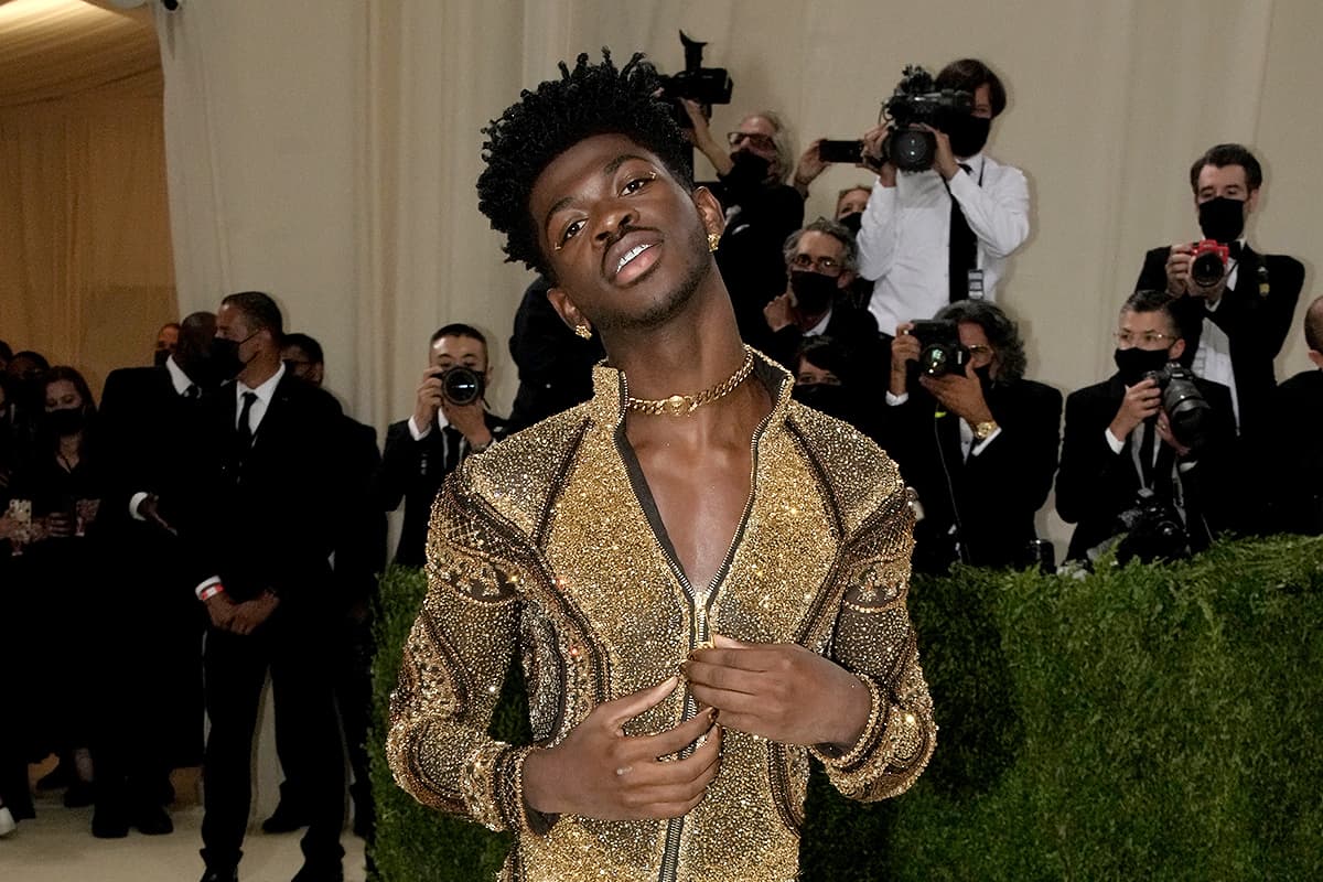 Rapper Lil Nas X at the Met Gala 2021 wearing a gold chain choker