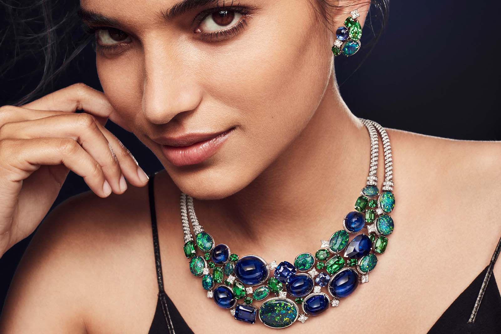  A model wears Louis Vuitton La Constellation d’Hercule necklace featuring  50.20-ct of opals, tanzanite, tsavorite and 15 LV Monogram-cut diamonds from the Bravery by Louis Vuitton Collection 