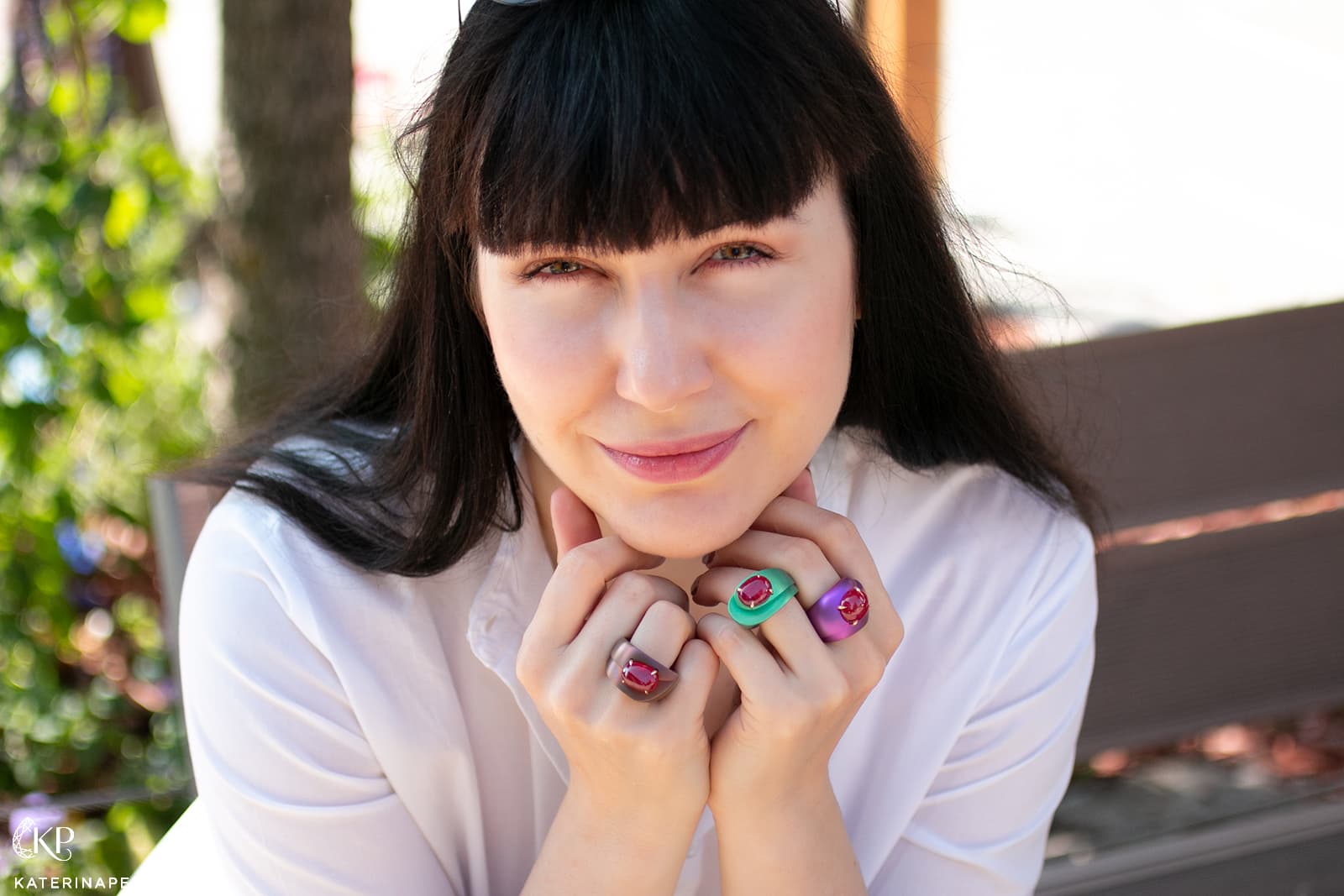 Katerina Perez wears a trio of coloured gemstone and titanium rings from the Mashandy Collection by Philippe Guilhem