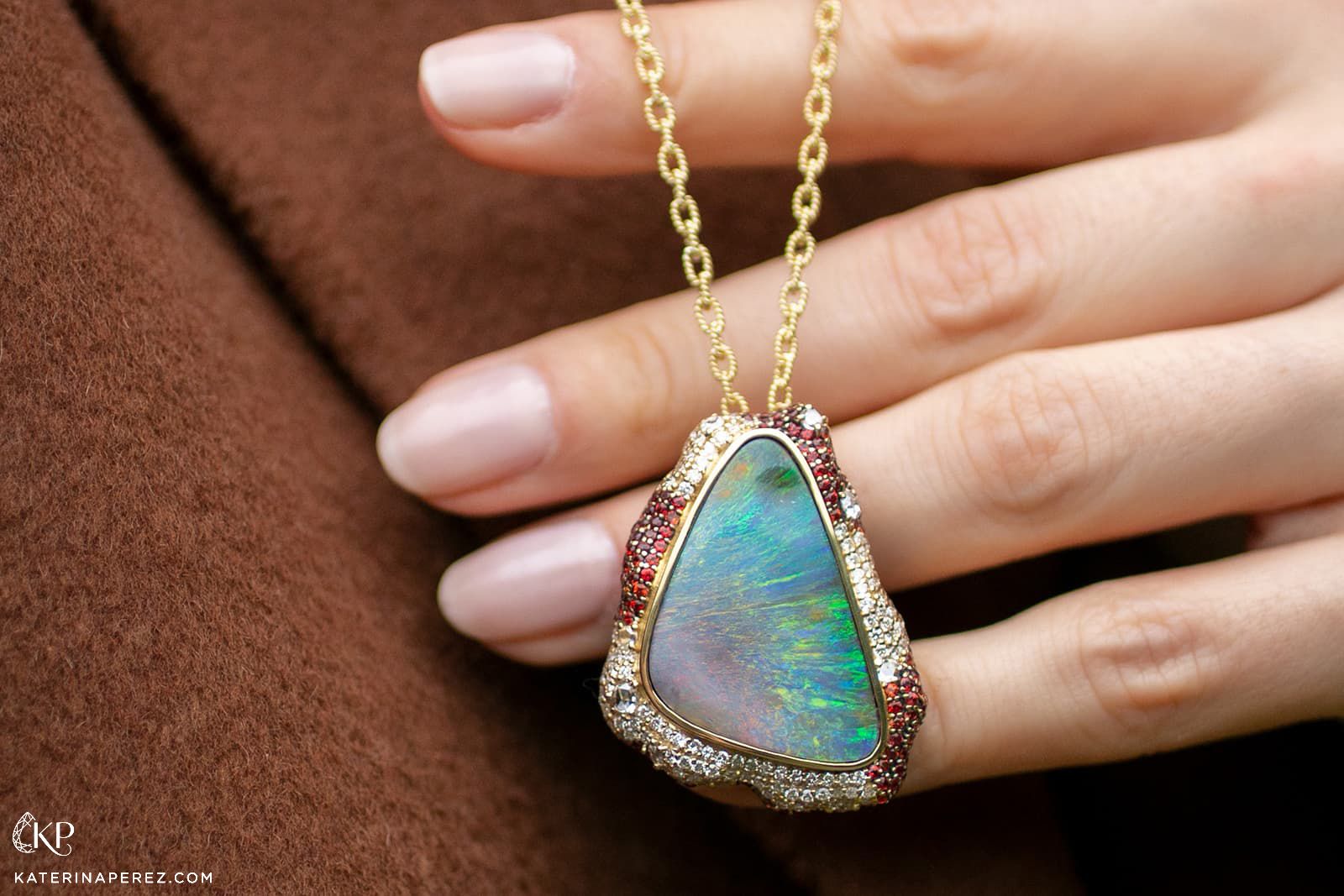  An opal pendant with rubies and diamonds in yellow gold by Emil Weis Opals