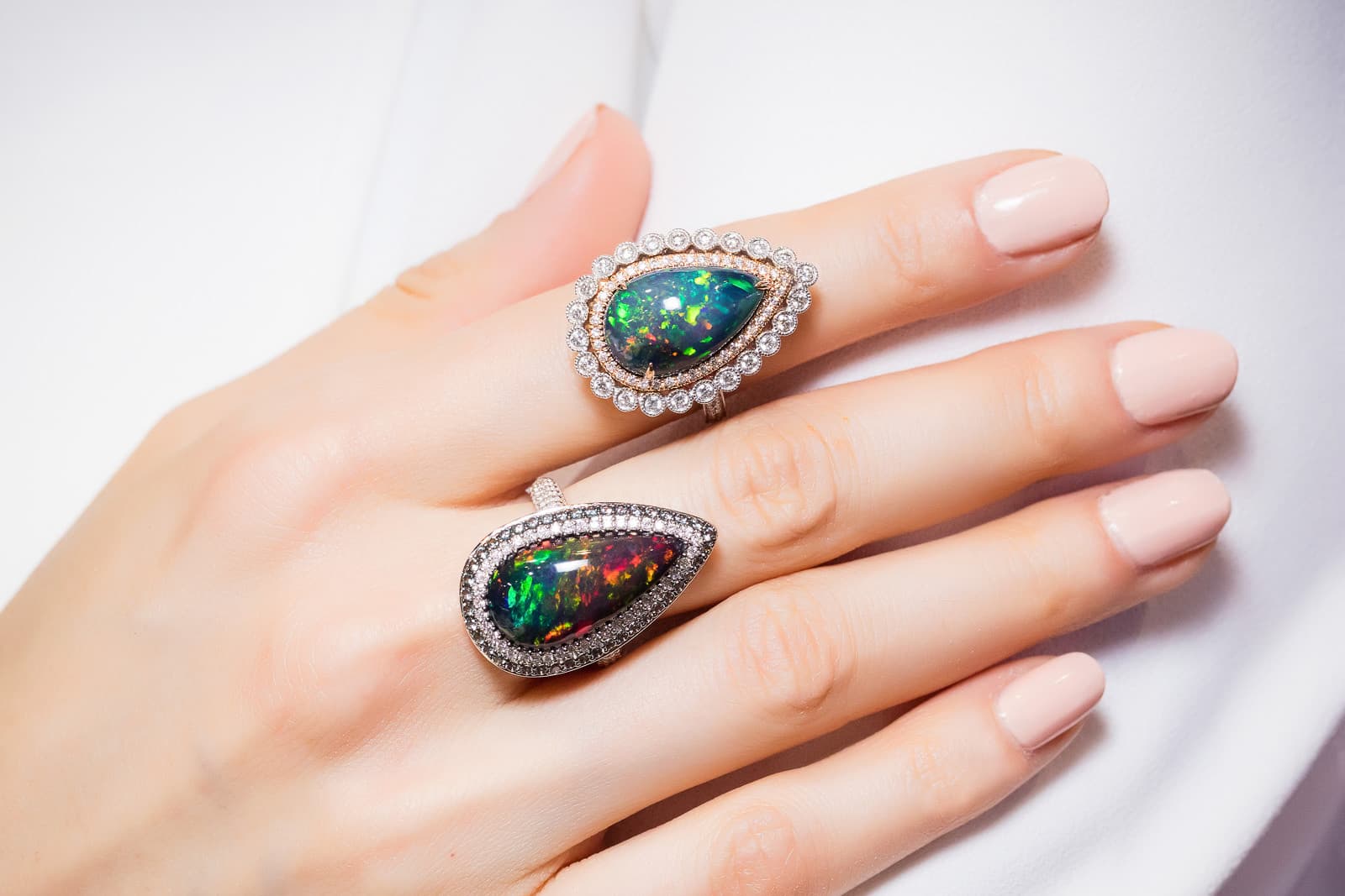 Two pear-shaped black opal and diamond cocktail rings by Yael