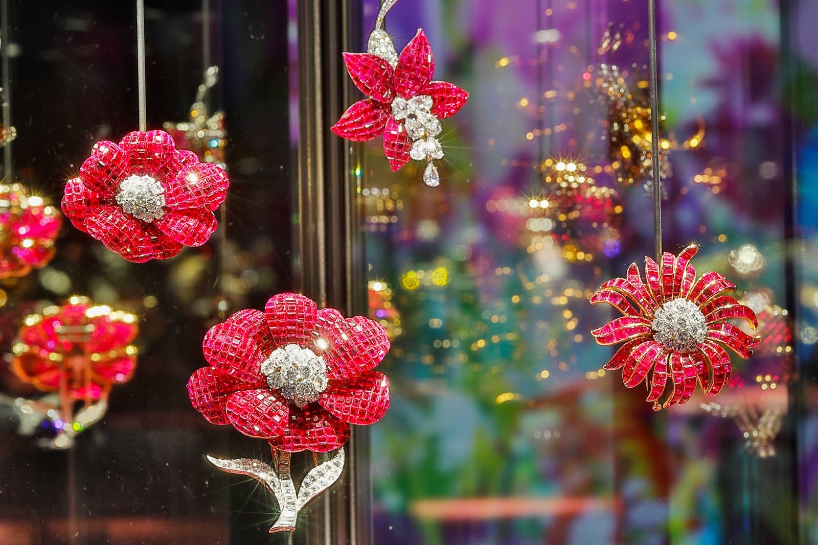   Van Cleef & Arpels ‘Mystery Set’ floral clips with rubies and diamonds from 1937, presented as part of the Florae exhibition