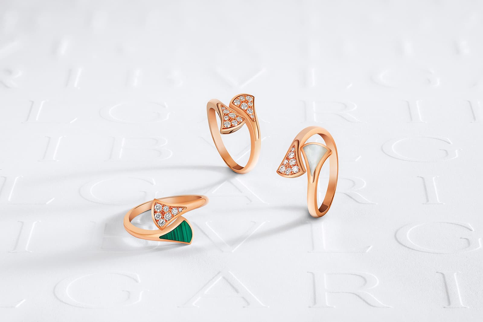  A trio of Bulgari Diva's Dream rings with diamonds, malachite and mother of pearl in rose gold