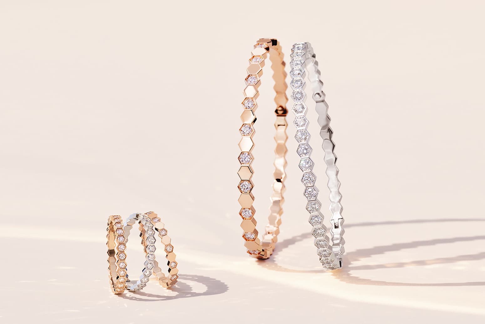  Chaumet Bee My Love pavé brilliant cut diamond rings in rose and white gold, alongside Bee My Love half pavé brilliant cut diamond bracelets in rose and white gold