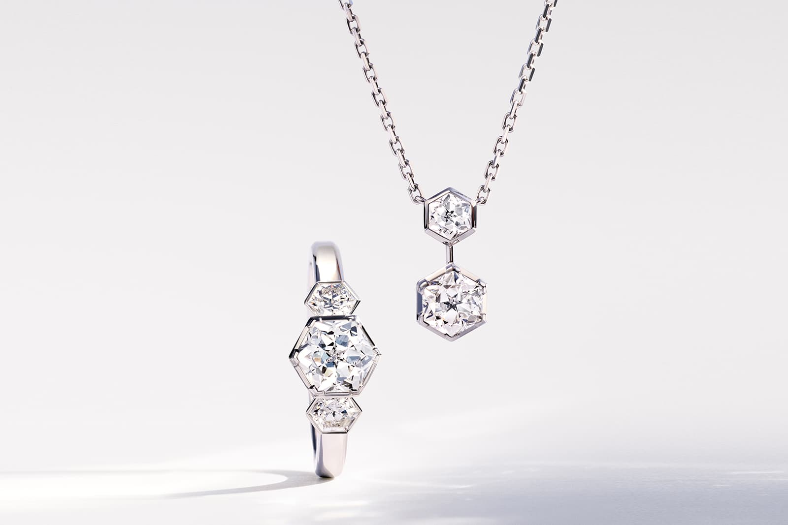  Chaumet Bee My Love ring in white gold set with three Taille Impératrice-shaped diamonds, alongside a matching Bee My Love pendant 