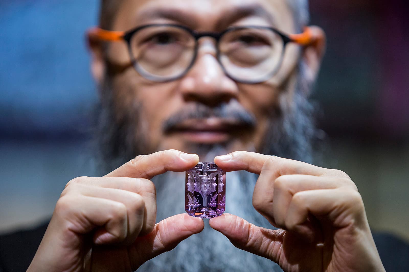Wallace Chan holds a gemstone with a unique Wallace Cut - one of his own innovations in gemstone artistry