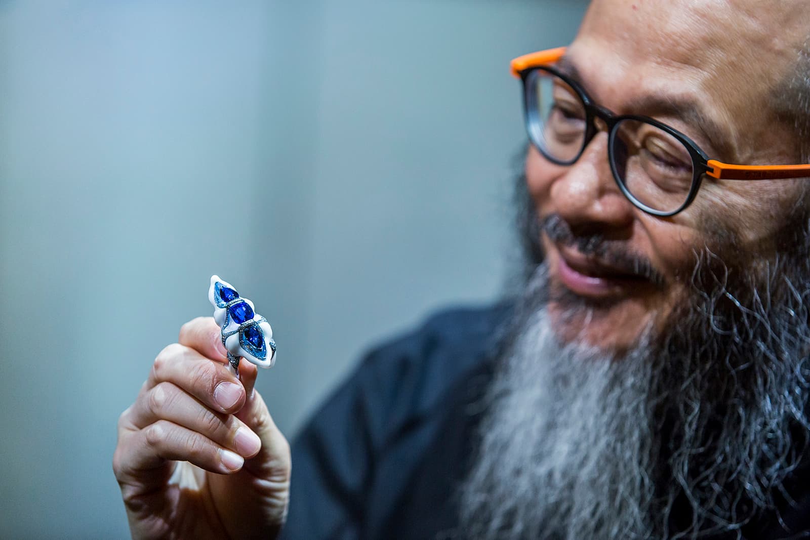 Wallace Chan holds a unique ring design crafted with Wallace Chan Porcelain, an innovative use of materials that took seven years to master