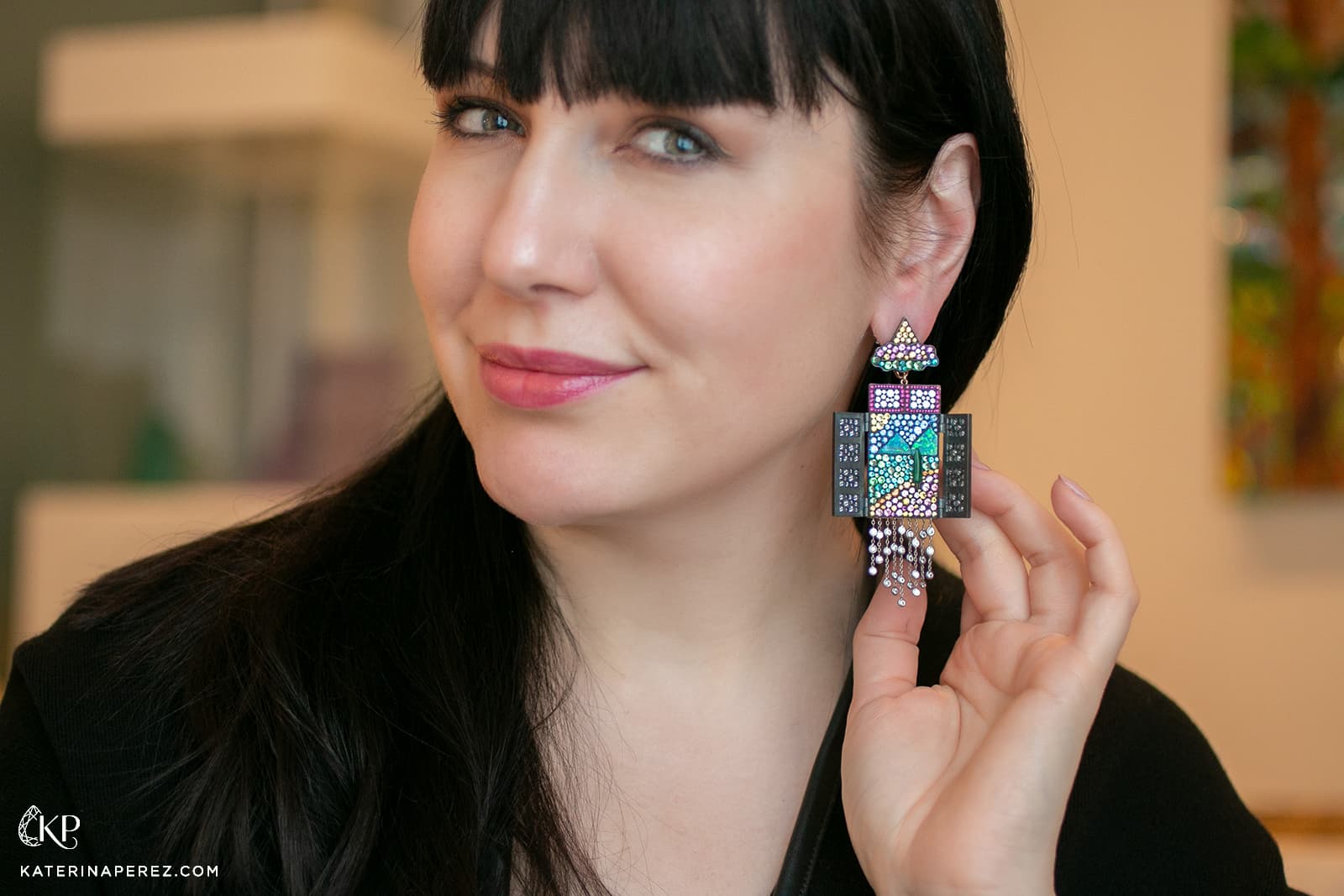 Katerina Perez wears the 'A Window Open to Paradise' earrings by Antonio Seijo 