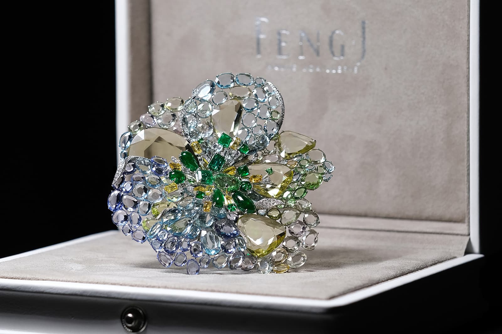 Feng J ‘Icy Green Dahlia’ brooch from the Garden of Impressionism collection with ‘Floating Set’ double rose-cut gemstones, including Colombian emeralds, purple and yellow sapphires, tanzanites, tsavorites and diamonds 