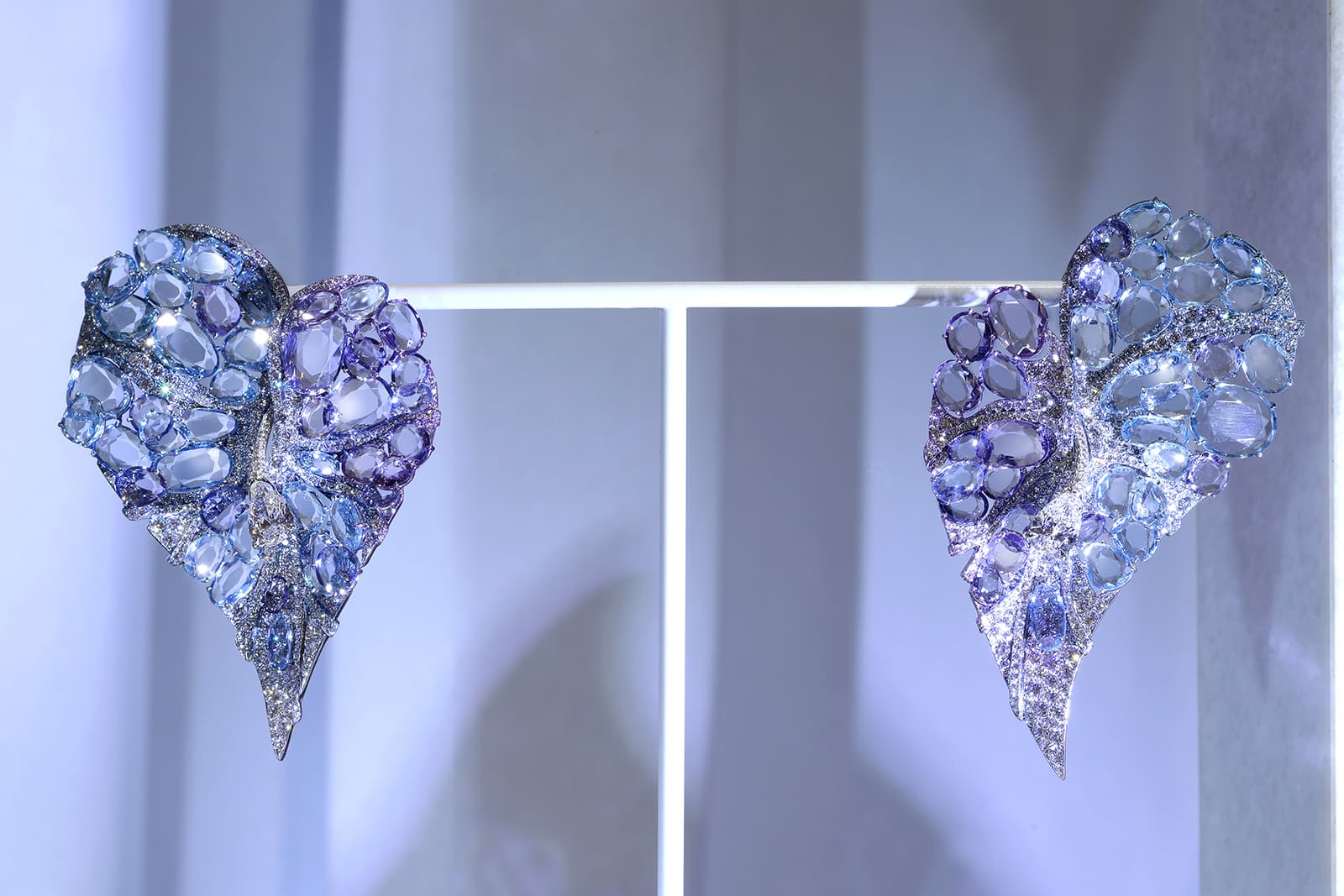  Feng J Anthurium earrings from 'The Garden of Impressionism' collection featuring 'Floating Set' gemstones in shades of blue, purple and lilac