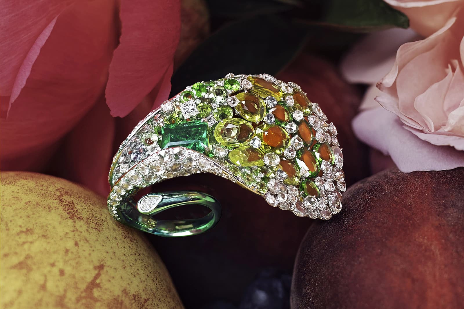 Feng J Calla Lily ring from the Garden of Impressionism collection with a Colombian emerald and ‘Floating Set’ double rose-cut sapphires, tsavorites and white diamonds in green electroplated 18k gold