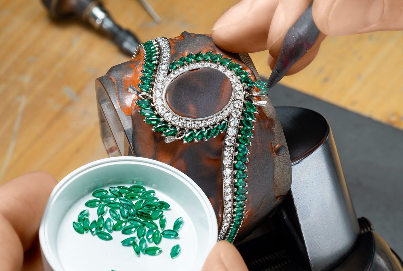 Setting a Piaget watch emeralds 