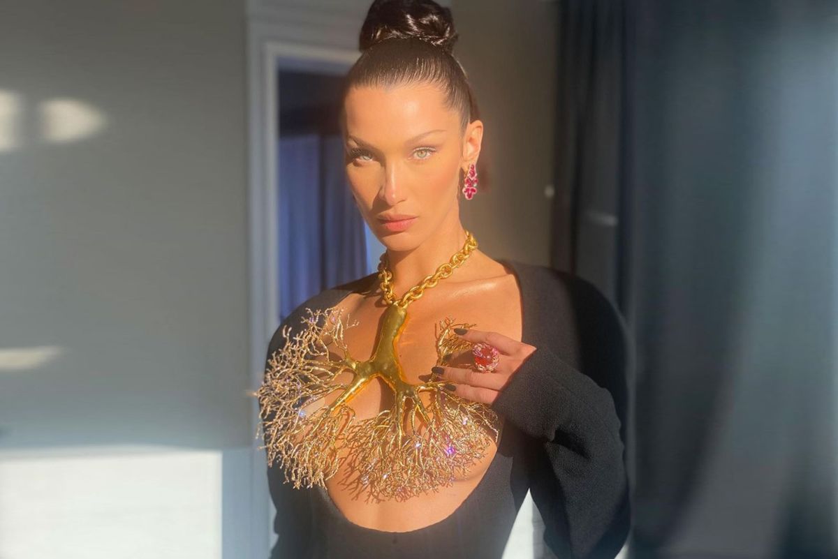 Model Bella Hadid at the Cannes Film Festival in a Gold Lung necklace by Daniel Roseberry for Schiaparelli’s FW 2021 Couture collection