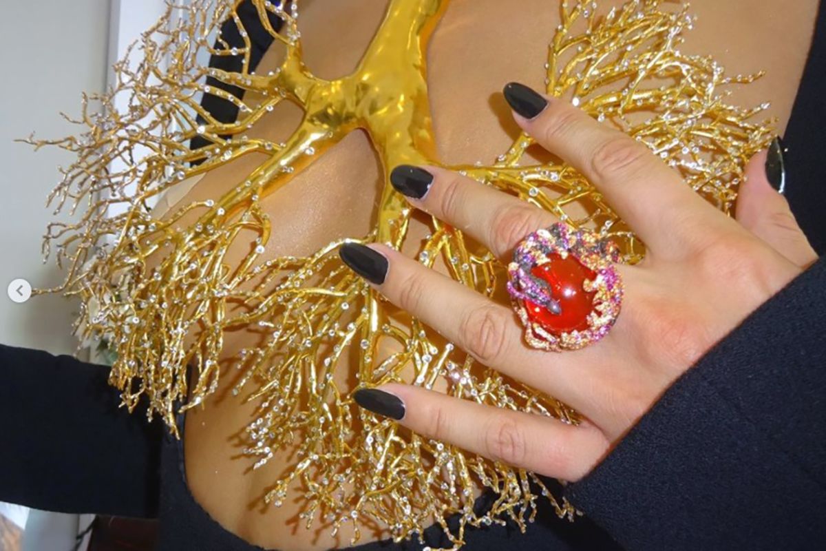  Model Bella Hadid wore the Gold Lung necklace by Daniel Roseberry for Schiaparelli’s FW 2021 Couture collection and the Phoenix cocktail ring by Chopard to the Cannes Film Festival 2021