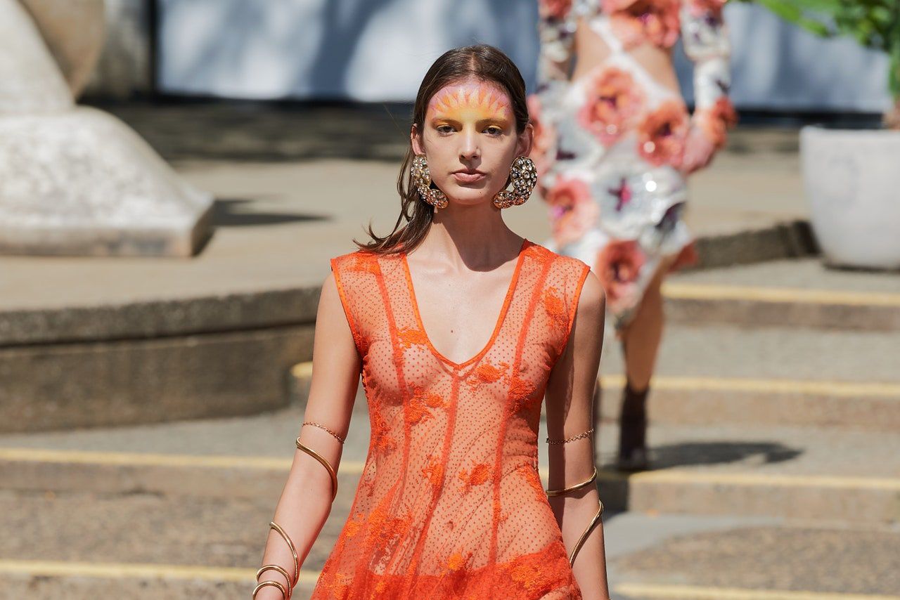  Statement sculptural gold earrings on the catwalk at Rodarte for SS22