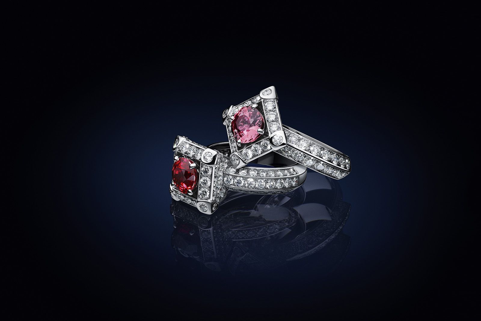 Two Louis Vuitton Bravery II High Jewellery Cocktail Rings, one set with a 1.34 carat round-cut ruby and 120 brilliant-cut diamonds for 2.31 carats, and the other set with a 1.30 carat round-cut orange-pink sapphire and 100 brilliant-cut diamonds for 2.51 carats, both in white gold 