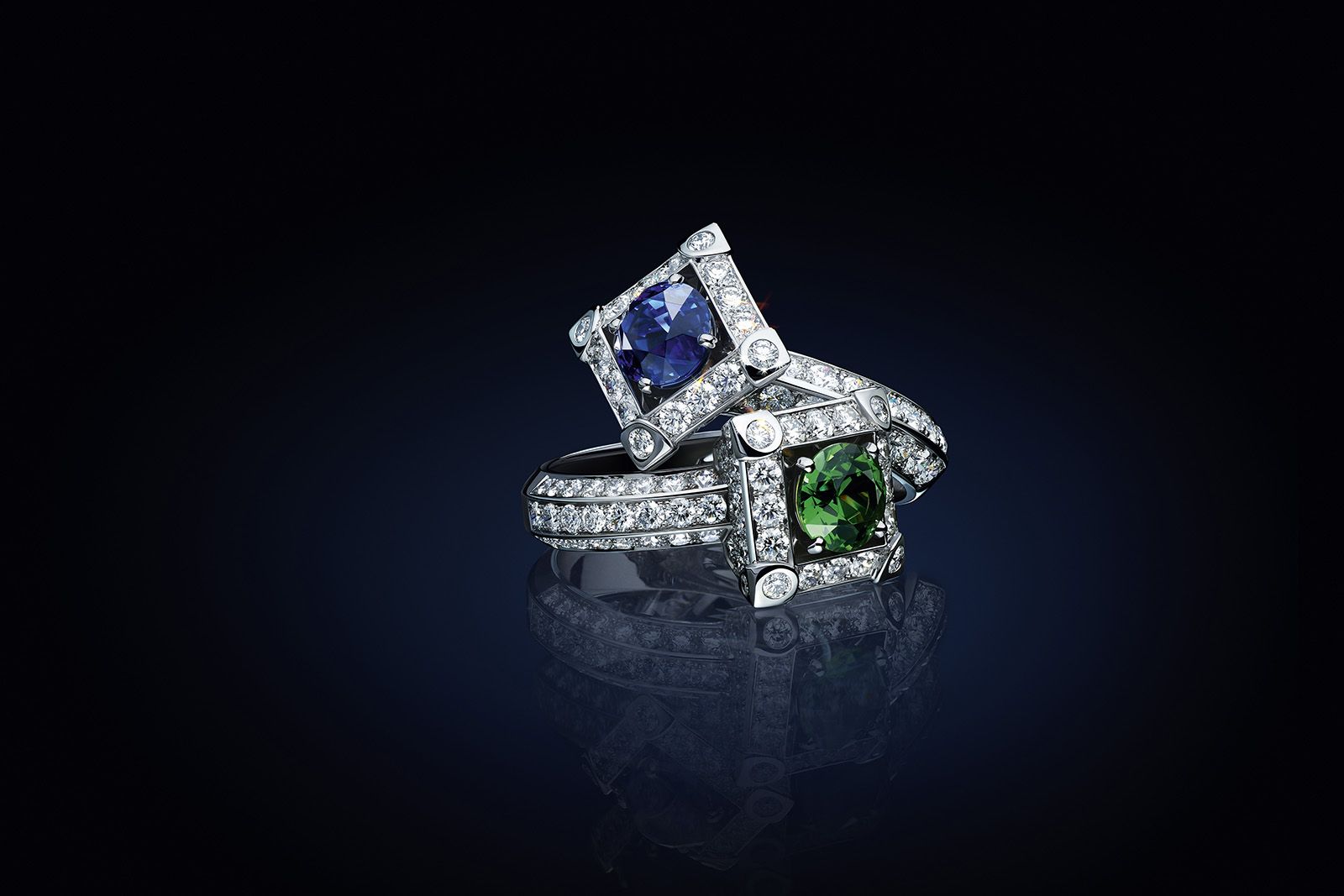  Two Louis Vuitton Bravery II High Jewellery Cocktail Rings, one set with a 2.09 carat round-cut sapphire and 100 brilliant-cut diamonds for 2.48 carats, and the other set with a 1.34 carat round-cut demantoid garnet and 120 brilliant-cut diamonds for 2.30 carats, both in white gold 