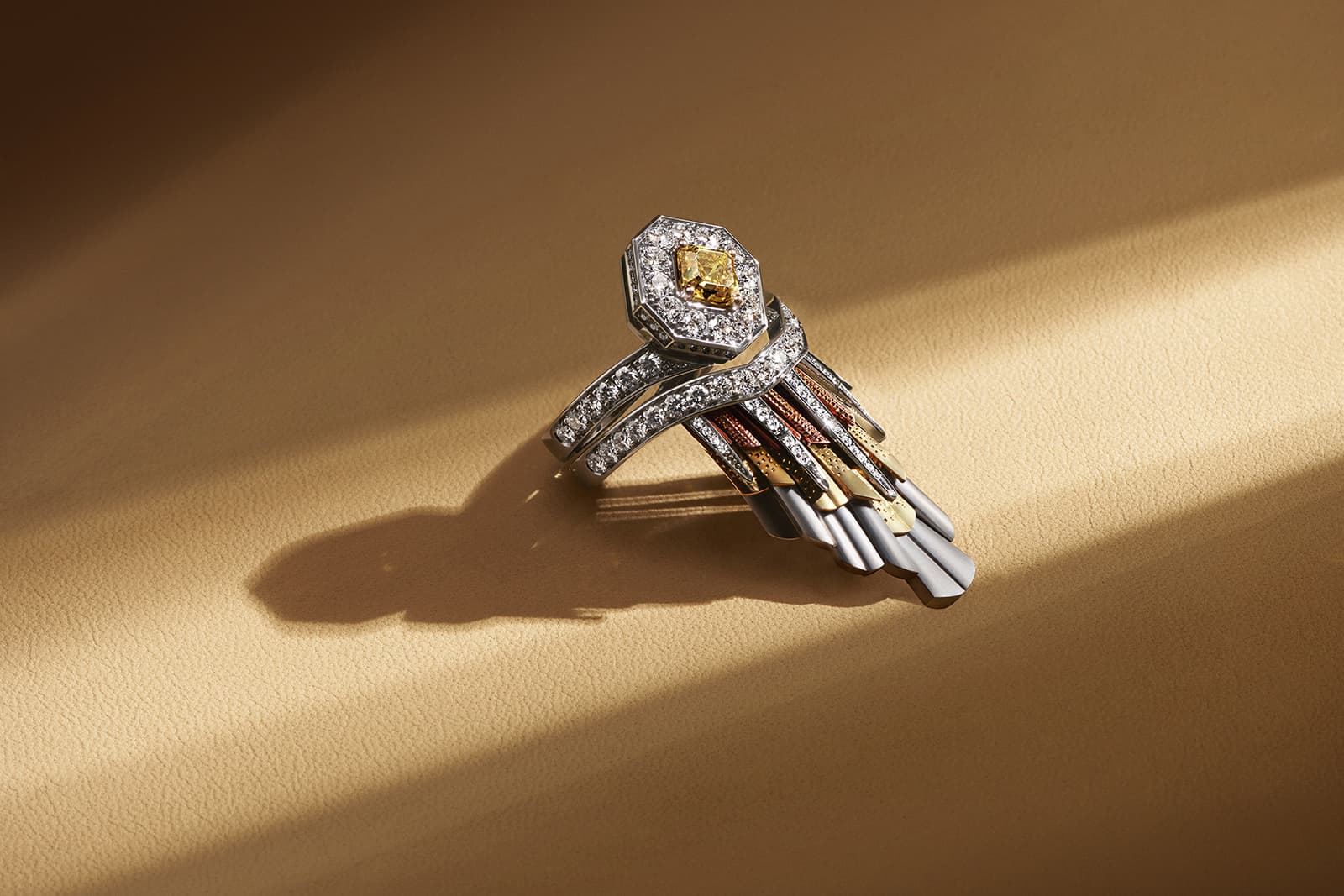  De Beers Jewellers The Alchemist of Light High Jewellery Light Rays Crown ring with a 1.08 carat fancy vivid orange yellow square emerald-cut diamond 