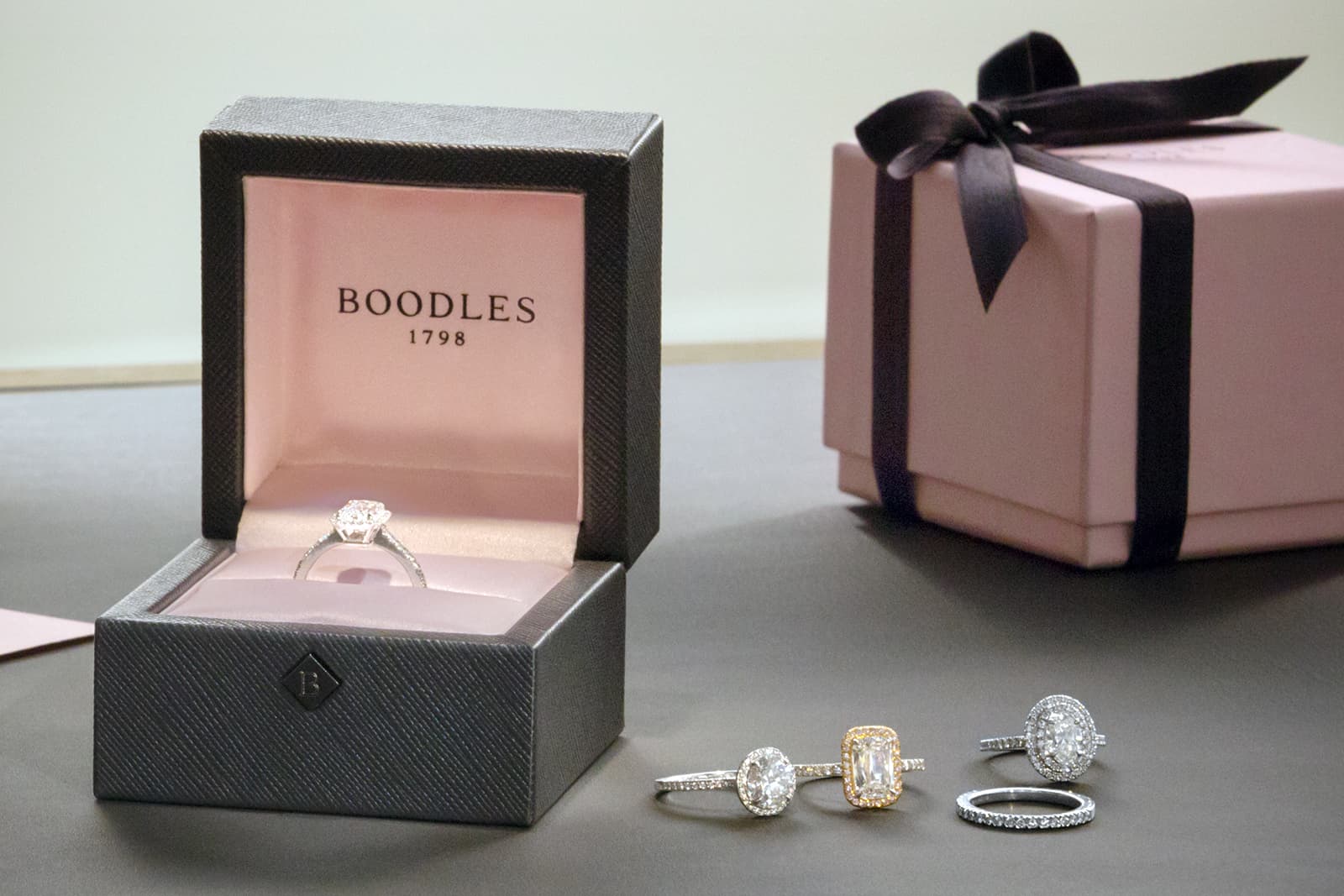  Boodles ring boxes with its pink brand hue lining the inside