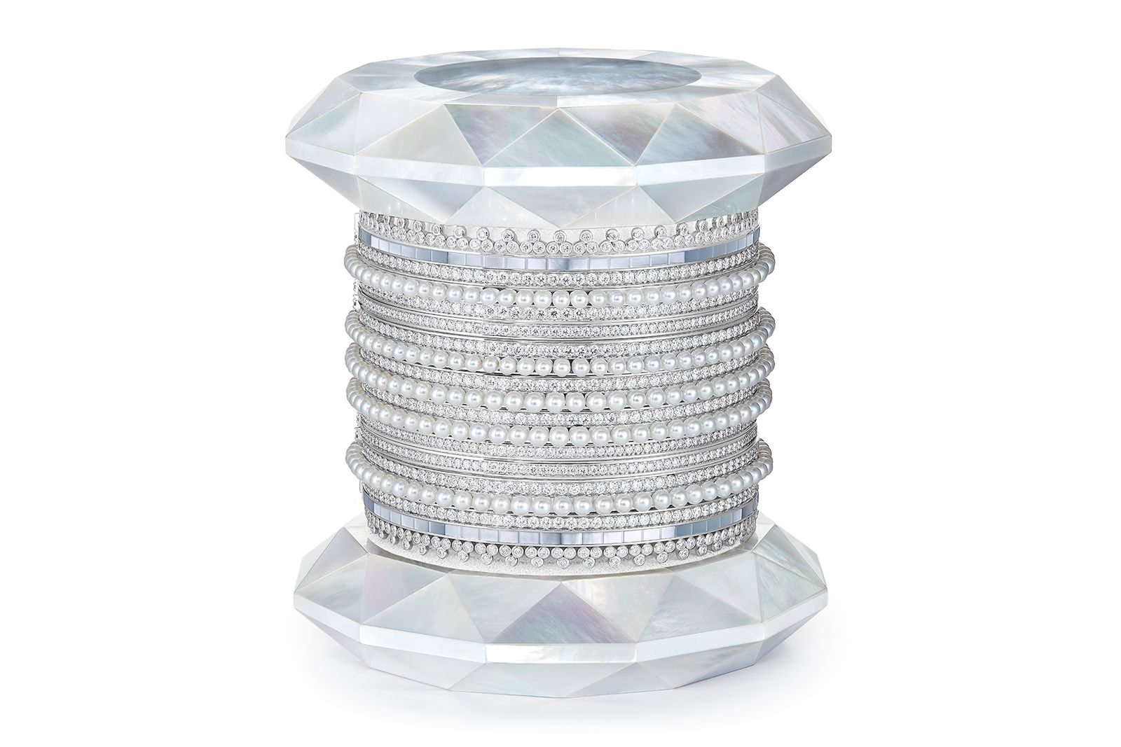  Boucheron New Churiyans bracelets with diamonds, mother-of-pearl and cultured pearls from the Histoire de Style New Maharajahs High Jewellery Collection, housed on a wooden bobbin with mother of pearl marquetry and goat suede leather