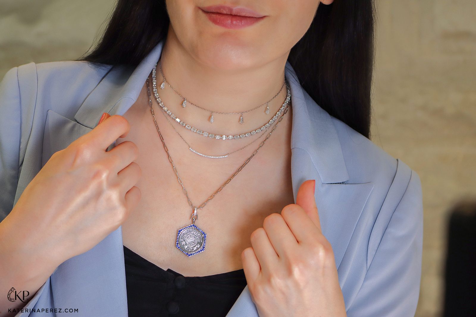 Katerina Perez wears the Yataghan Ginea pendant necklace in gold and sapphires