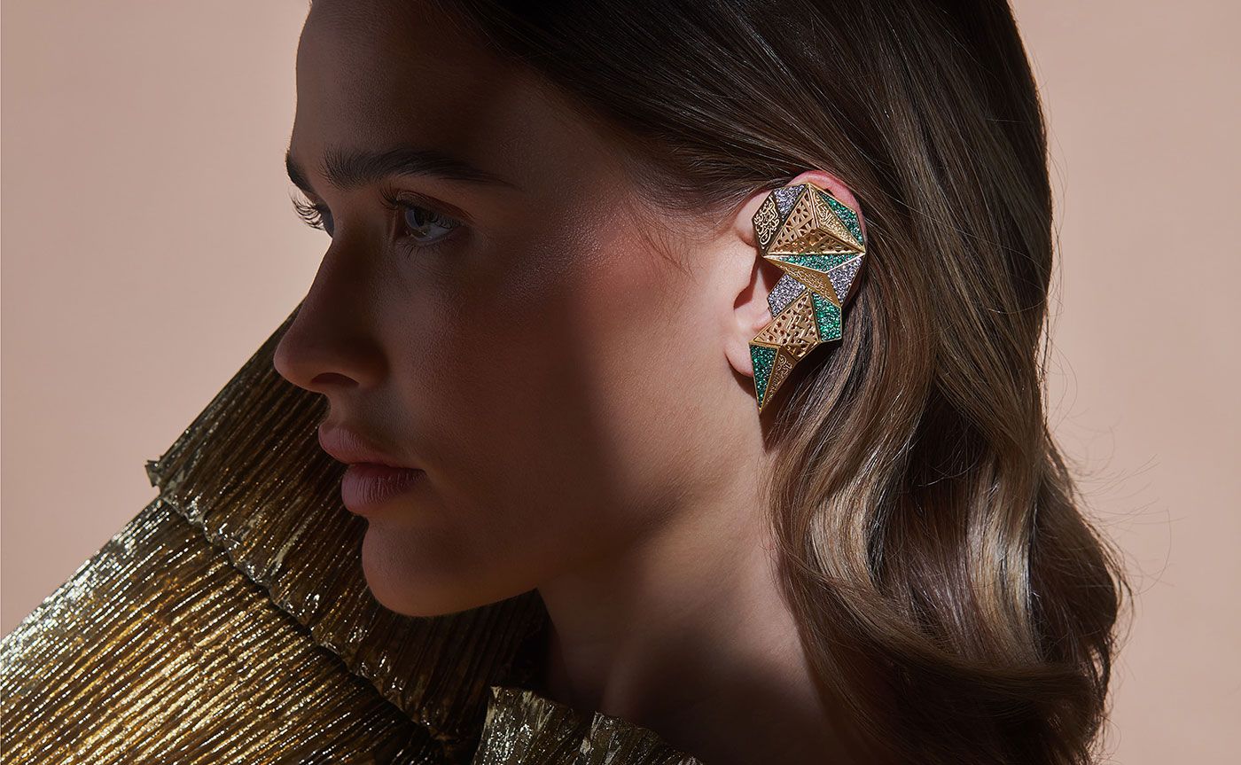  Roshan ear cuff in emeralds and diamonds by Yataghan