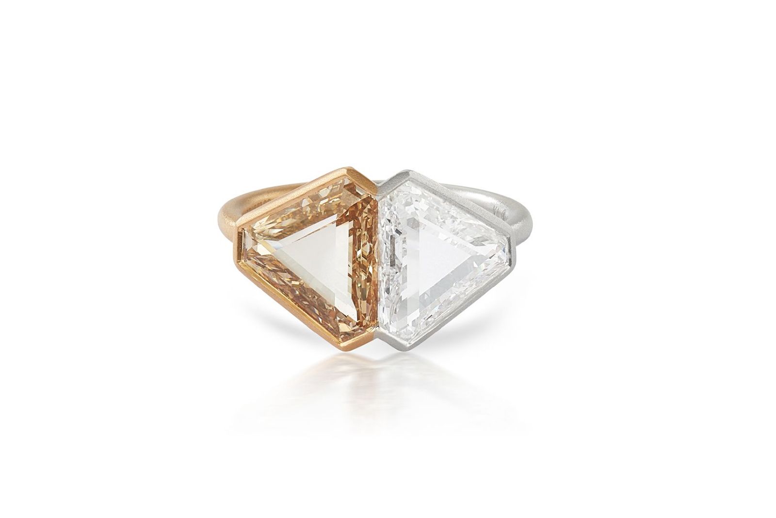  A 4.74 carat diamond ring with one fancy light yellowish brown triangle-cut diamond and one colourless triangle-cut diamond, set in white and pink gold, part of the Rock Party selling exhibition by A2Z and Christie’s Dubai