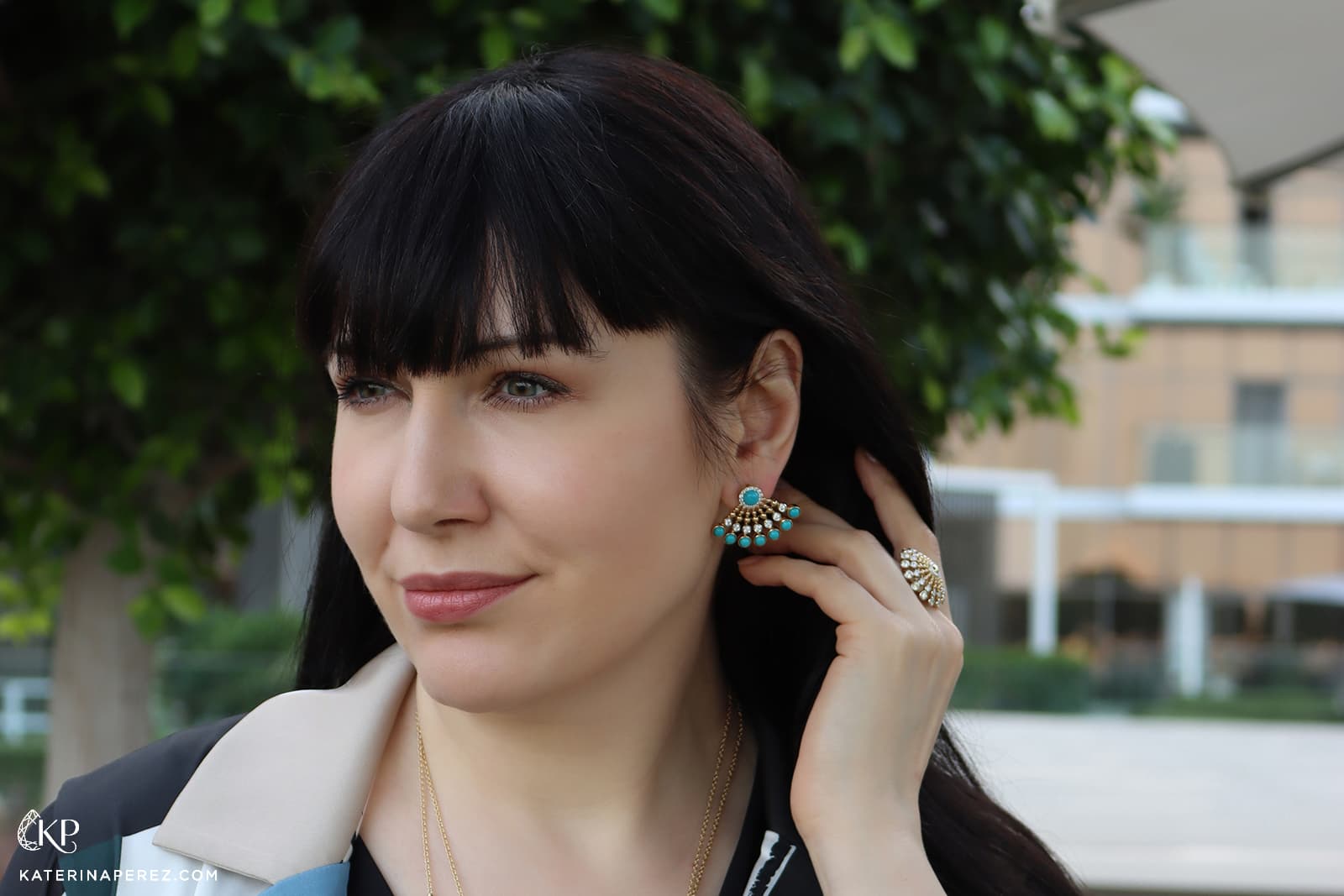 Katerina Perez wears gold and turquoise earrings from the FerriFirenze Bubbles collection
