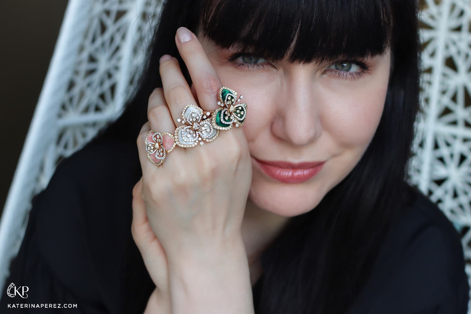  Katerina Perez wears a trio of FerriFirenze Clover rings with diamonds and coloured enamel in 18k gold
