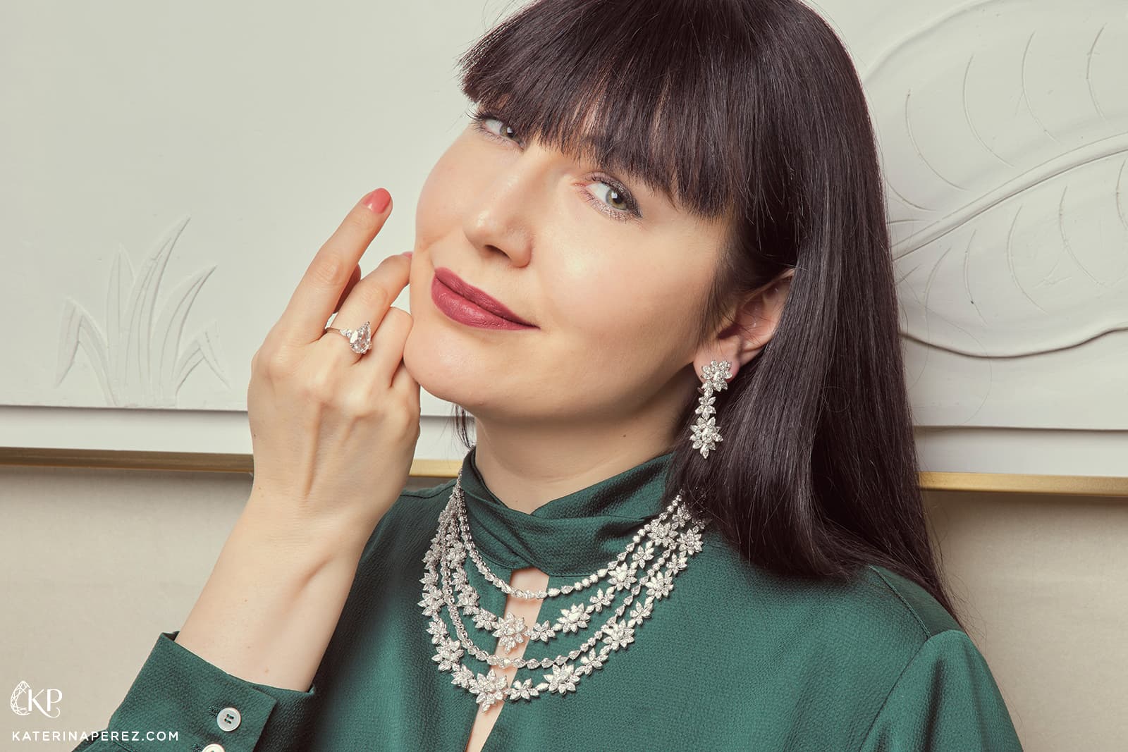Katerina Perez wears a diamond necklace, earrings and a pear-shaped diamond ring by Bayt Damas