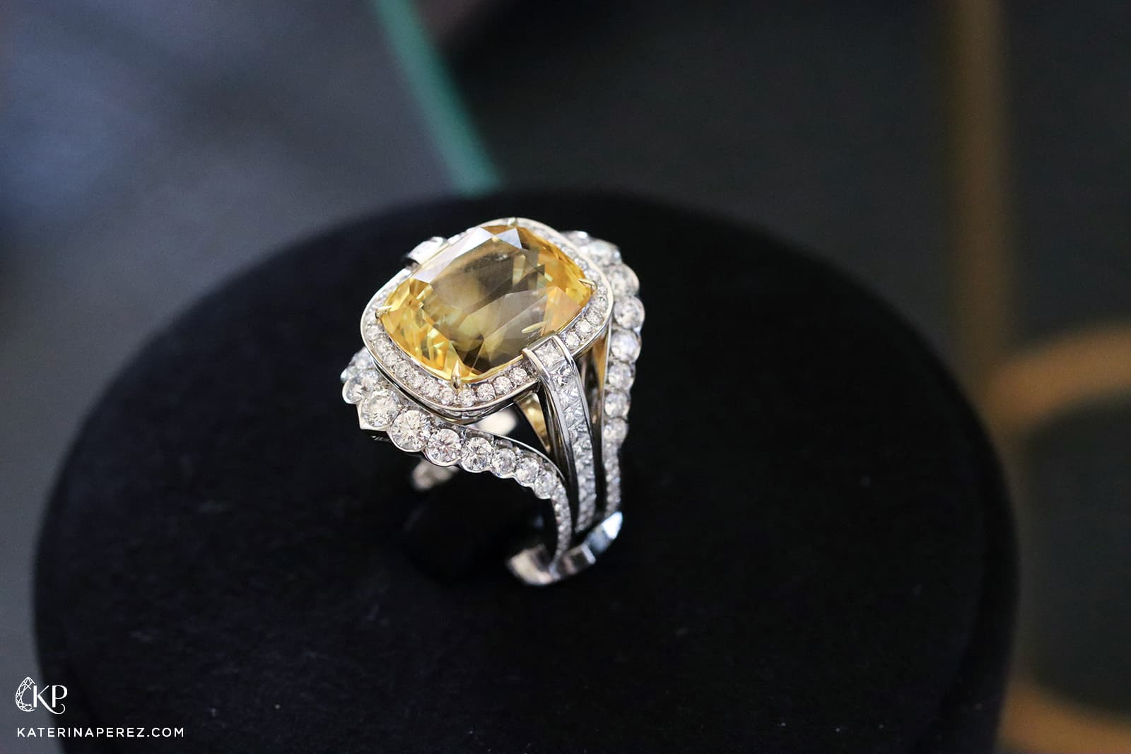  An Atelier Pino Spitaleri yellow sapphire ring worn with its matching diamond-set ring jacket