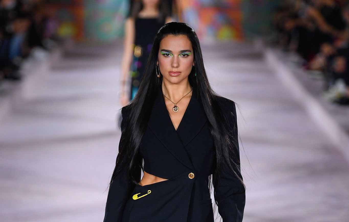 Singer Dua Lipa walks the catwalk at Versace for SS22