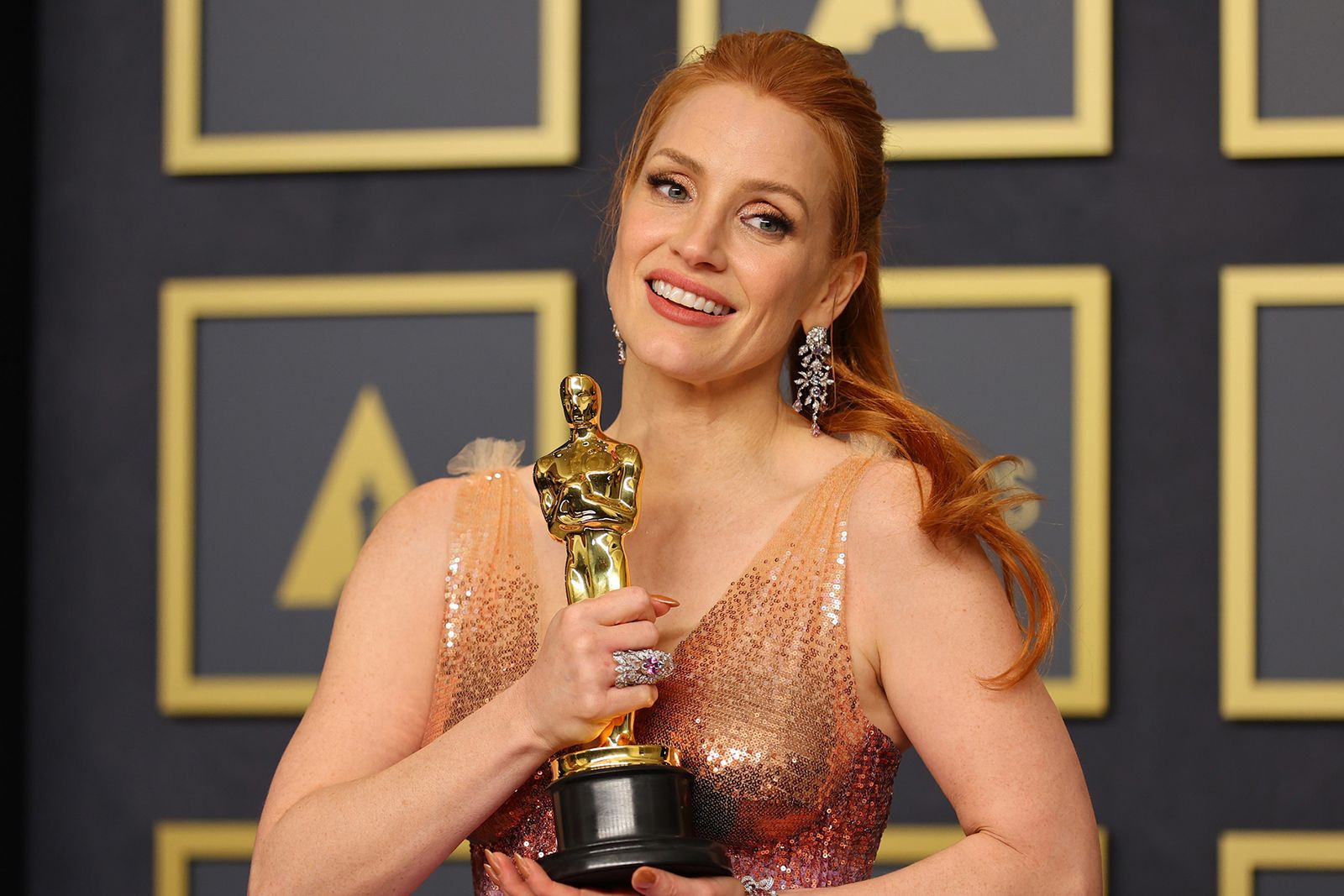 Best Actress winner Jessica Chastain wears Gucci High Jewellery on the Oscars 2022 red carpet