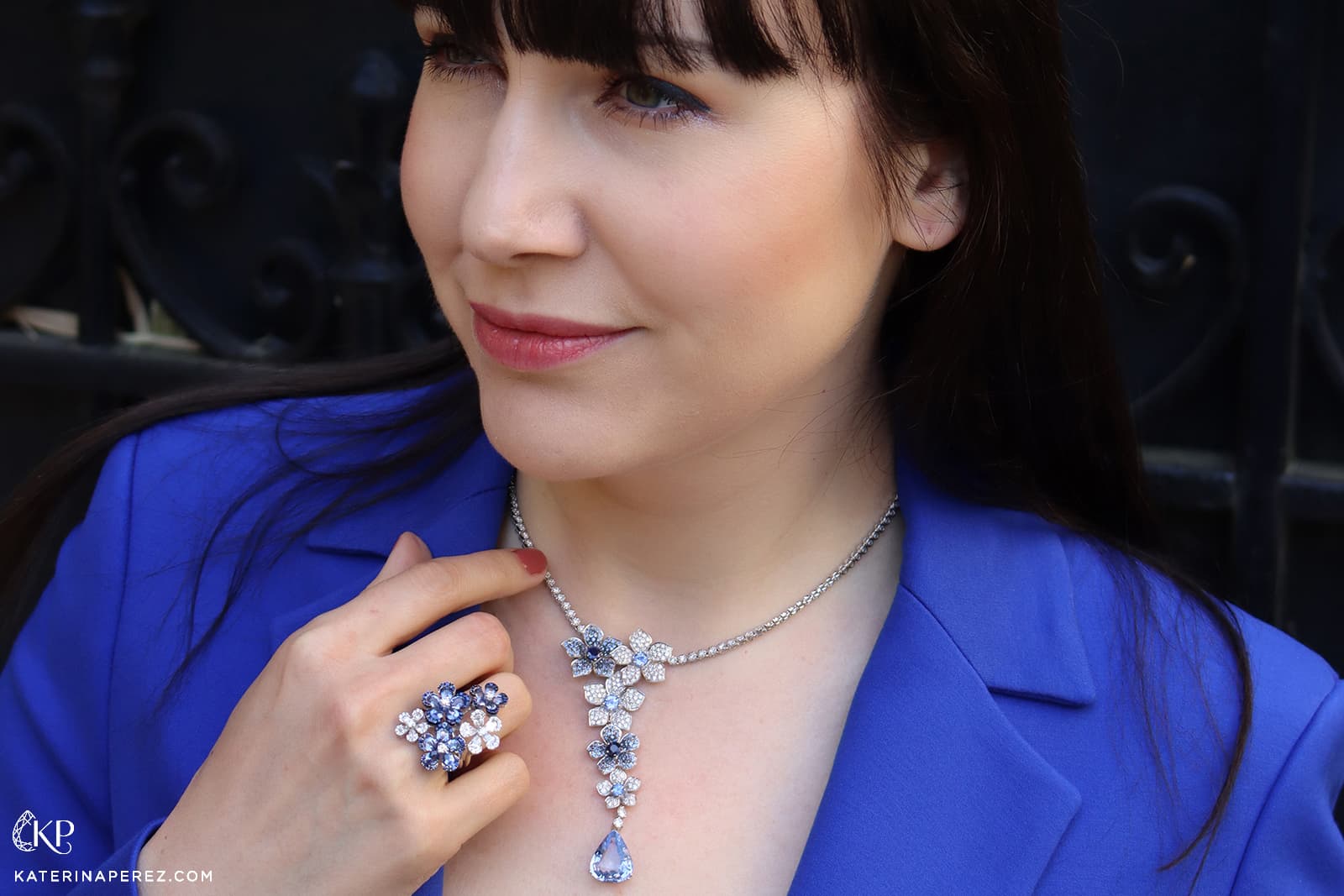 Katerina Perez wears a floral-inspired necklace by Cesare Pompanon 1936