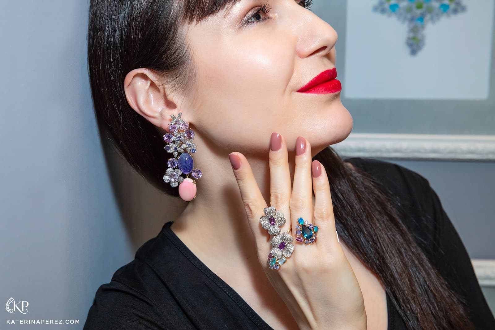 Katerina Perez wears flower inspired earrings and rings by Goldesign
