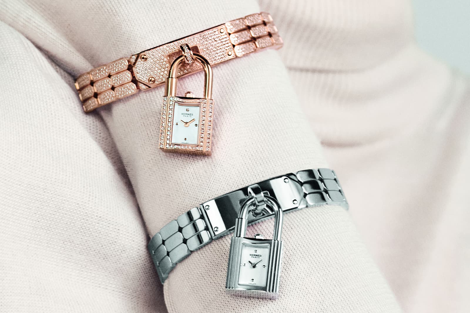  Two versions of The New Kelly watch by Hermès in rose gold and steel with diamonds