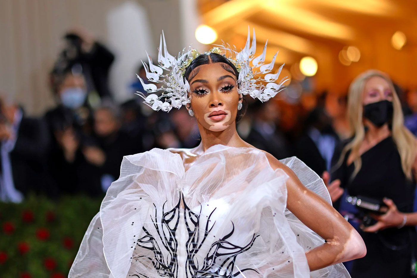  Winnie Harlow wears an extravagant headpiece to the Met Gala 2022