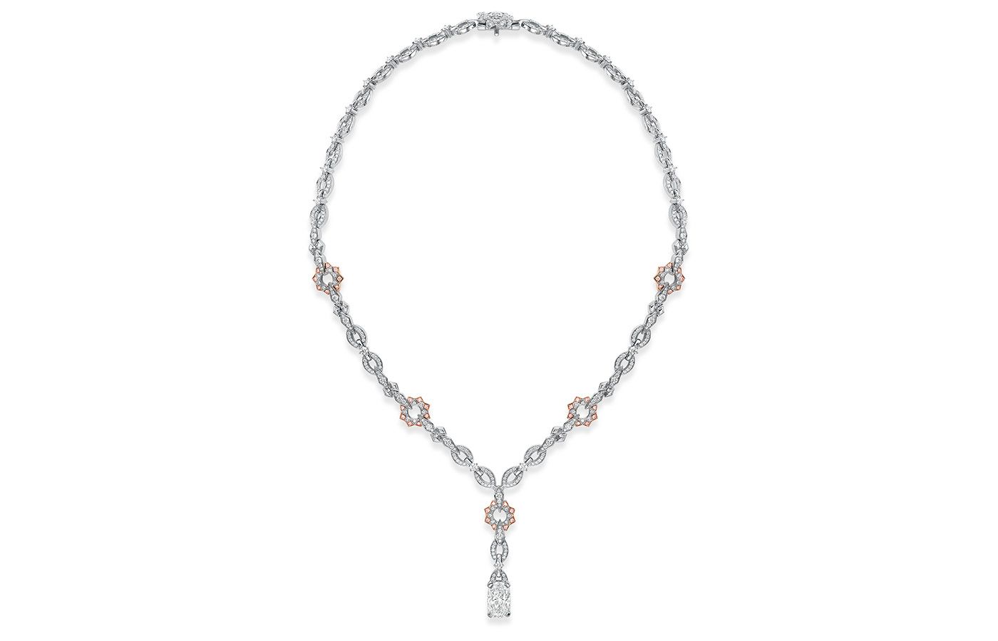 Boodles A Peace of Mined design necklace set with a cushion cut diamond in platinum and 18 carat SMO rose gold