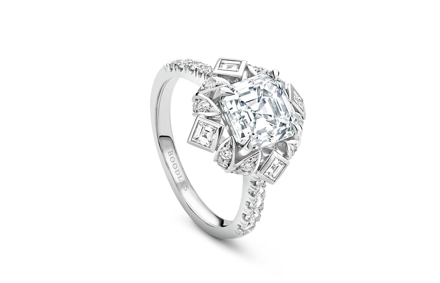  Boodles A Peace of Mined design ring set with an emerald cut diamond in platinum