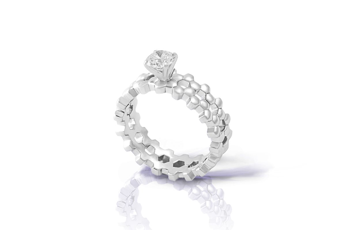  A stackable diamond solitaire Harmony ring from the signature Maison Mirath collection