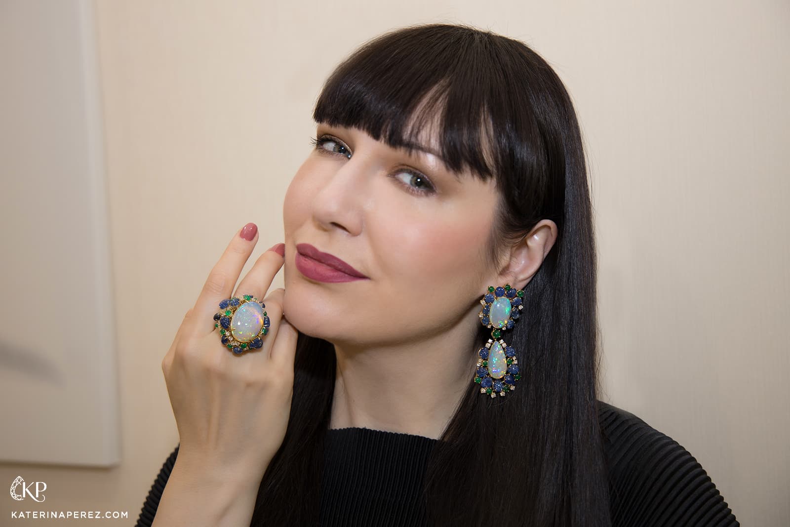 Katerina Perez wears the Veschetti Luna jewellery set with opals, emeralds, diamonds and carved Burmese sapphires 