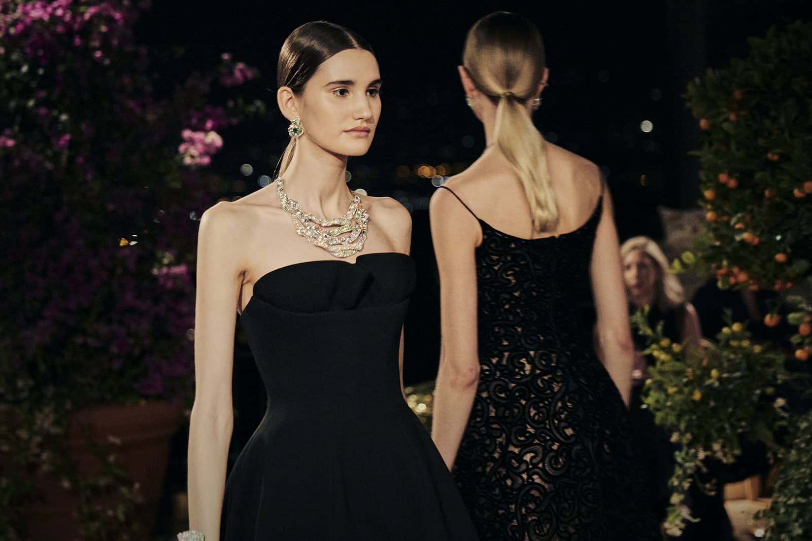  A model wears a striking necklace from the Dior Print High Jewellery collection with diamonds, emeralds, rubies, blue, yellow and pink sapphires, Paraiba-type tourmalines and tsavorites garnets, among other gems