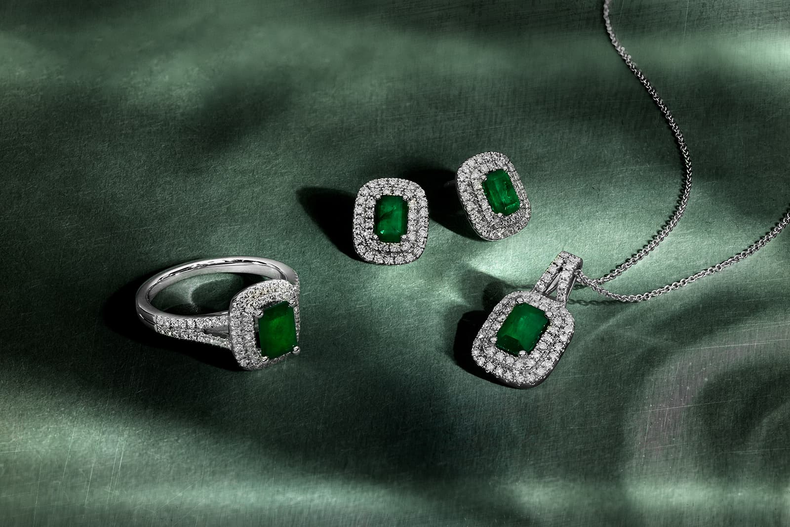  A suite of matching emerald and diamond jewellery pieces by Le Vian
