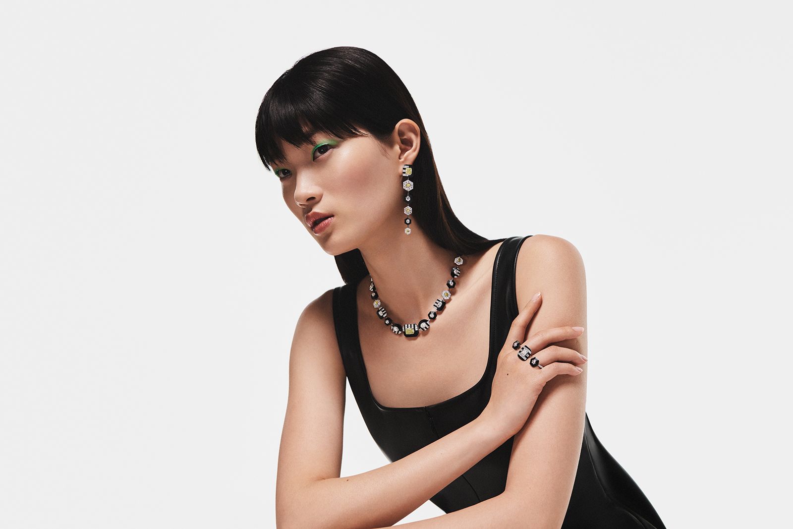 A model wears De Beers Optical Wonder pieces from The Alchemist of Light High Jewellery collection
