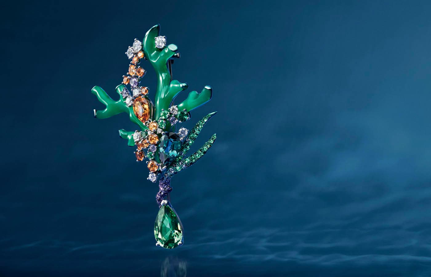 Chaumet Treasure Hunt brooch in white gold, titanium, tsavorite garnet, green tourmaline, mandarin garnet, emerald, purple sapphire and diamond from the Ondes et Merveilles High Jewellery collection