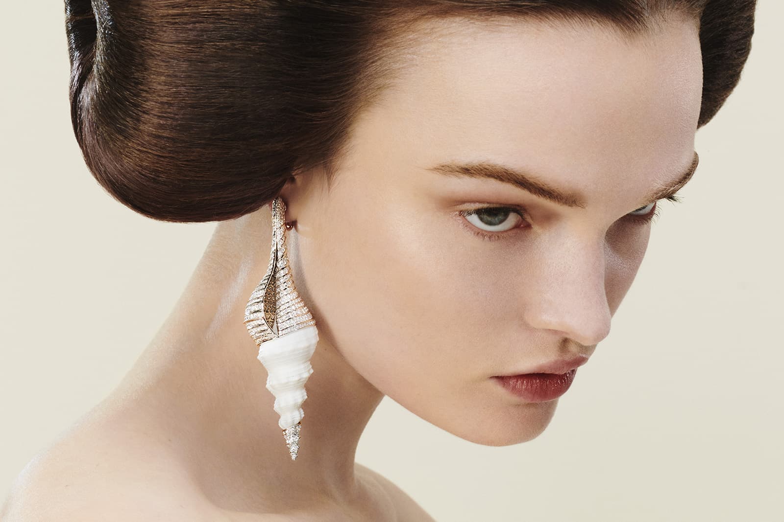 Boucheron natural shell Fusinus Colus, mother-of-pearl, diamond and white gold Coquillage Diamant earrings from the Carte Blanche Ailleurs High Jewellery collection