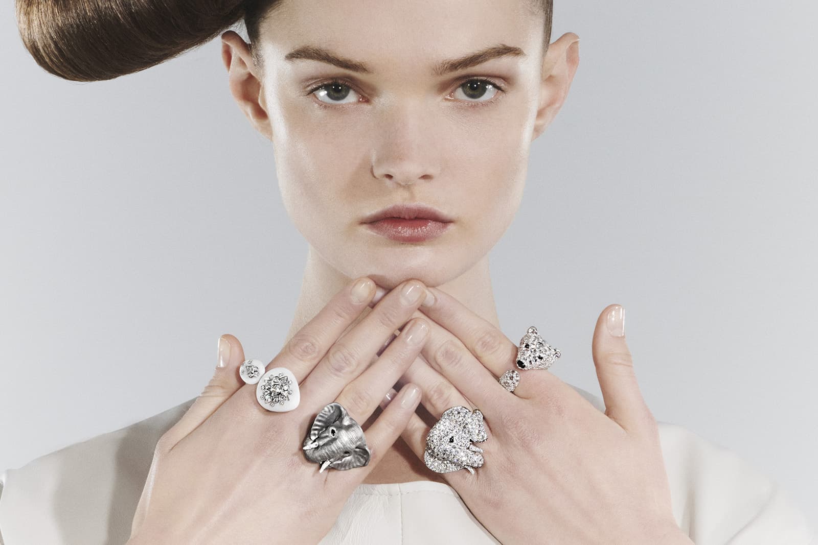  Boucheron natural pebble, diamond, onyx, sapphire, white gold and titanium Galet Diamant ring, The Elephant rings and Ourse Polaire ring from the Carte Blanche Ailleurs High Jewellery collection