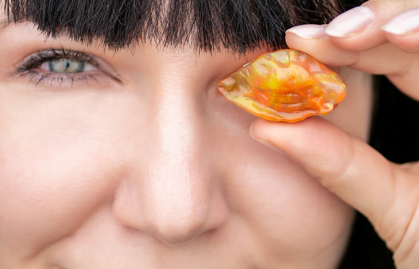  Katerina Perez holding a Fire opal from the Emil Weis Collection
