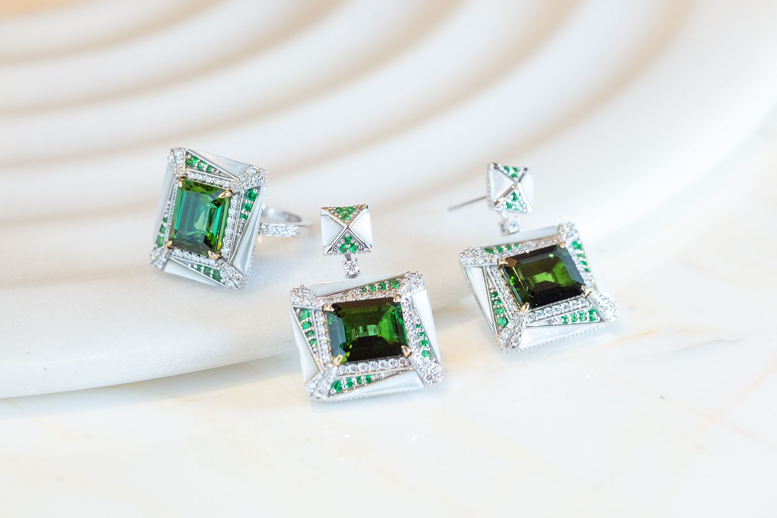 Sunita Nahata ring and matching earrings with green tourmalines, tsavorites, mother of pearl and diamonds in 18k white and yellow gold from the Mystic Green Tourmaline collection